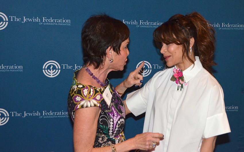Janis Collier embraces Paula Abdul.