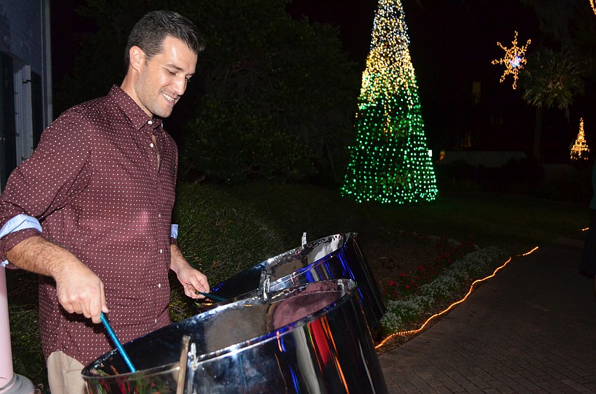 John Patti plays the steel drums for guests.