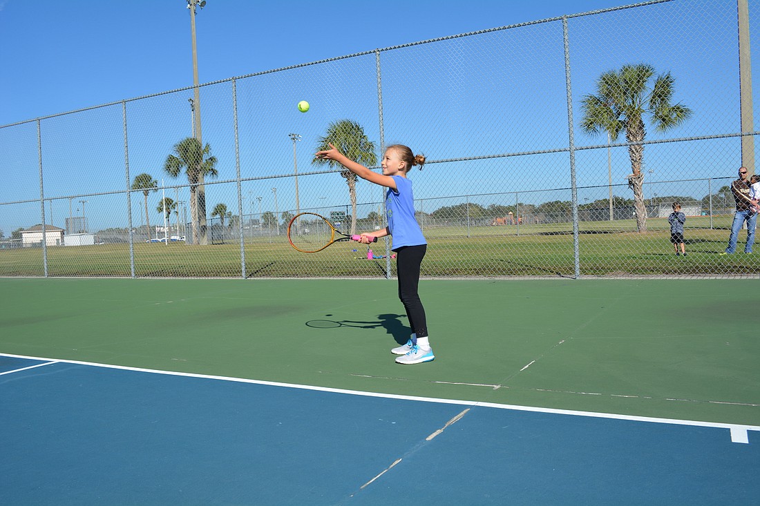 Eight-year-old Olivia Trawick, of Parrish, travels to Lakewood Ranch Park each week for her tennis lessons. The tennis courts are the closest public courts to her home.