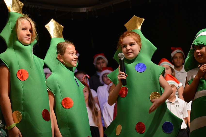 Trees Chelsea Grant and Hadley Lawrence listen as Addison Avery leads a discussion on candy cane color.