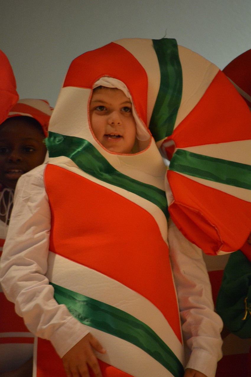 Aaron Gordon shows off the results of the battle between red and green candy canes — a dual-colored candy cane.