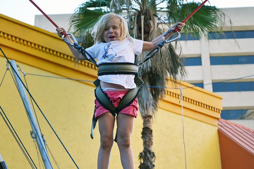 Heather Taylor gives her son Malachi a pep talk before he takes on the challenge climb for a chance to win $100.