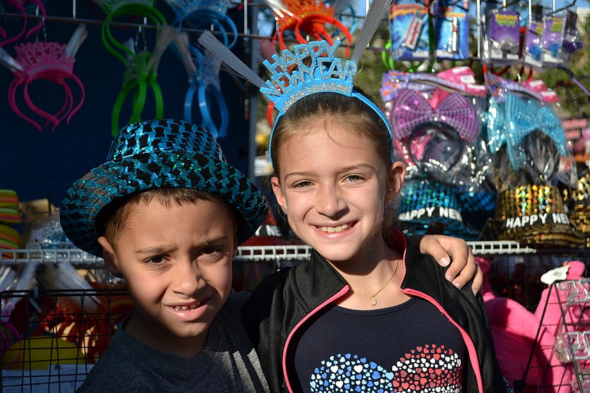 Nathan Frantz takes a twirl on a tea cup ride with his son Elliott.