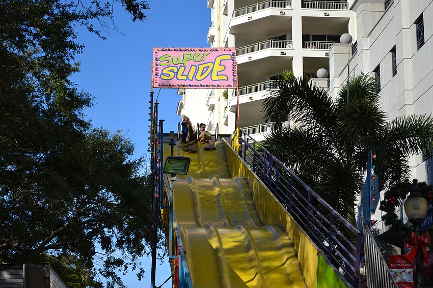 Yal Wang takes in the coaster during the carnival for the Pineapple Drop.