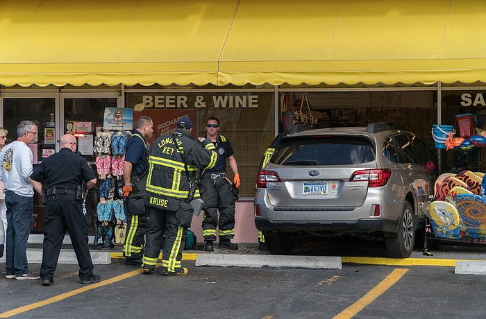 (Photo by Dex Honea) A driver crashed his car through the front of Harryâ€™s Convenience Store Monday.