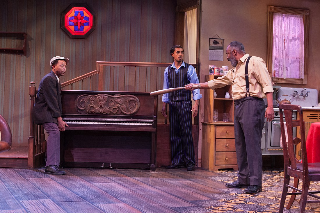 Boy Willie (Earley Dean), Lymon (Michael Mendez) and Doaker (Henri Watkins) face off over the piano, a family heirloom. Photo by Don Daly
