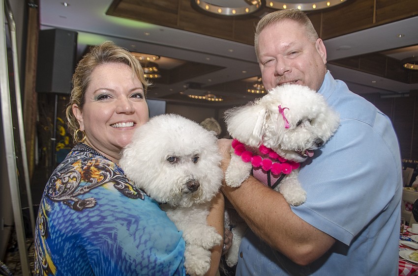 Veronica and Jeremy Miller pose with their dogs Duke Wellington and Duchess Alexandra.