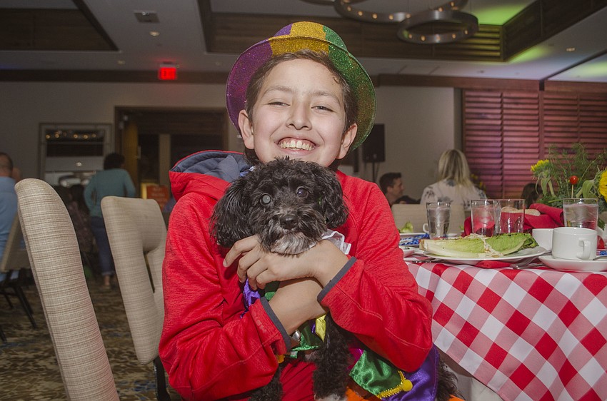 Will Marshall poses with dog Bootz.