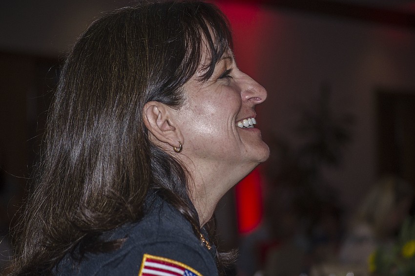 Bradenton Police Chief Melanie Bevan laughs during the best kisser portion of the Top Dog dog show.