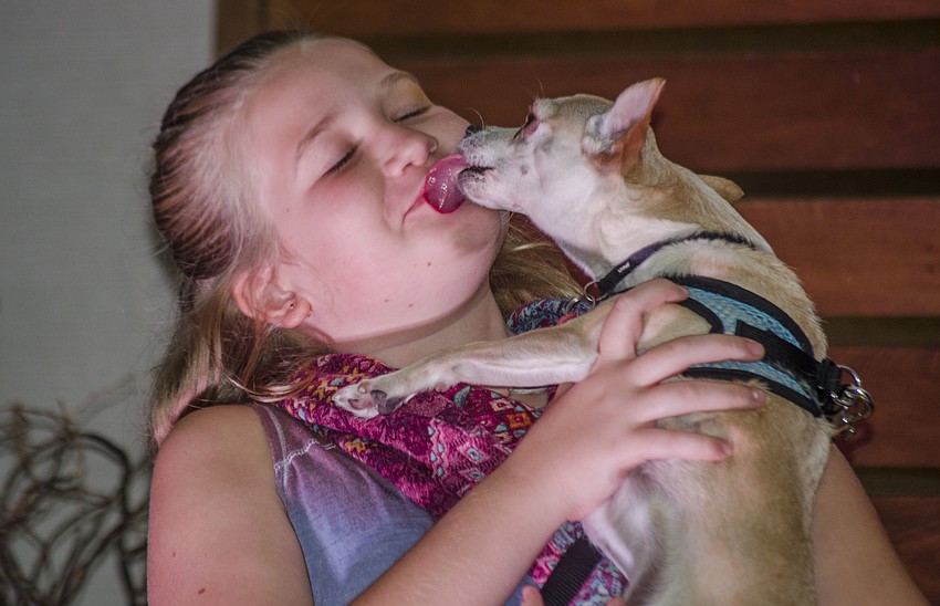 Lilah Davenport and dog Bruce compete in the best kisser contest.