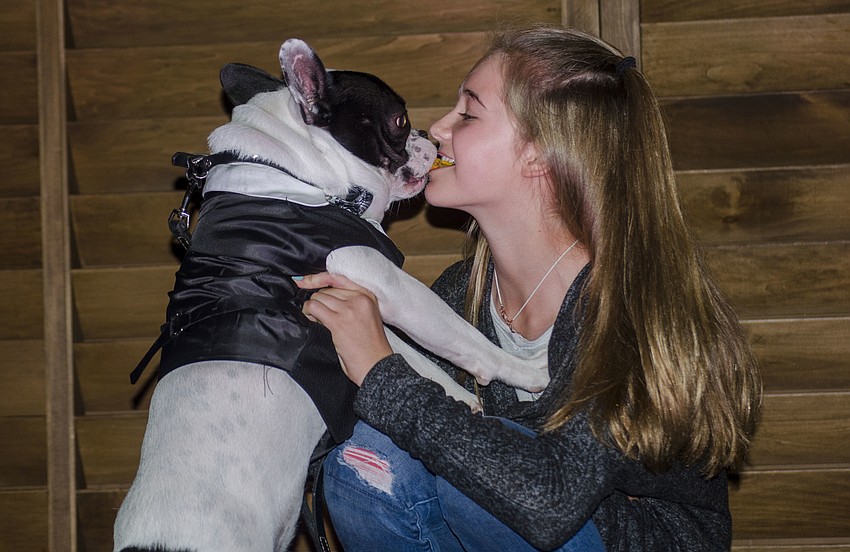 Juliana Howe and Gus compete in the best kisser contest.