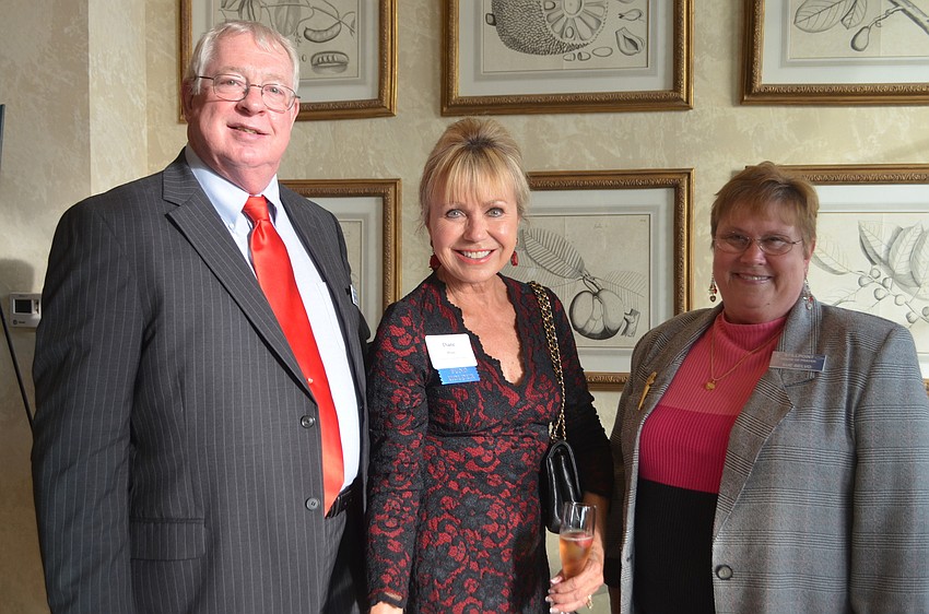 Jeff Belvo, president of Stillpoint House of Prayer, Diane Brune, Women'  s Charitable Foundation, and Sue Belvo, Stillpoint House of Prayer, celebrate the $4,000 grant that was given to Stillpoint at the 