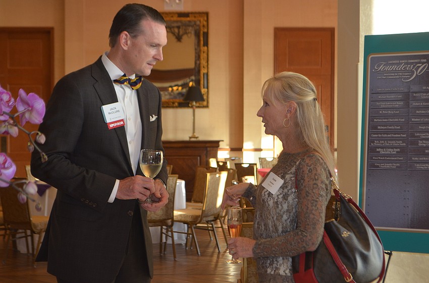 Jack McClure and Denise DeSchamps mingle.