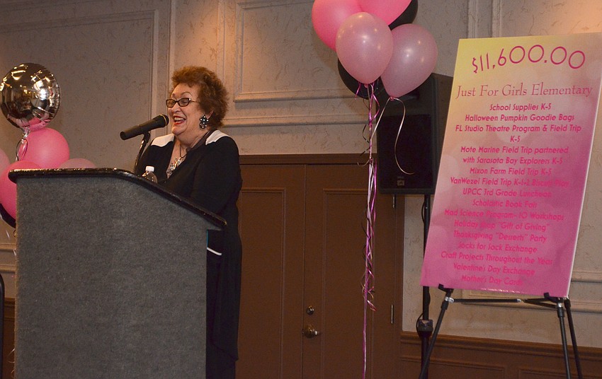 Debbie Palmer of Dillard’s laughs as she introduces the fashion show.