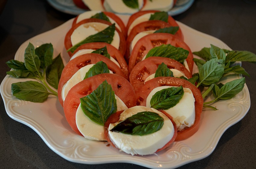 For lunch, guests enjoyed various salads, such as this caprese salad, baked salmon, chicken and rice and sticky toffee pudding for dessert.