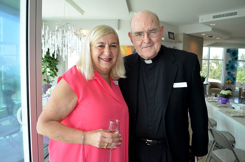 Hostess Ginny Akhoury and the Rev. Gerry Finegan