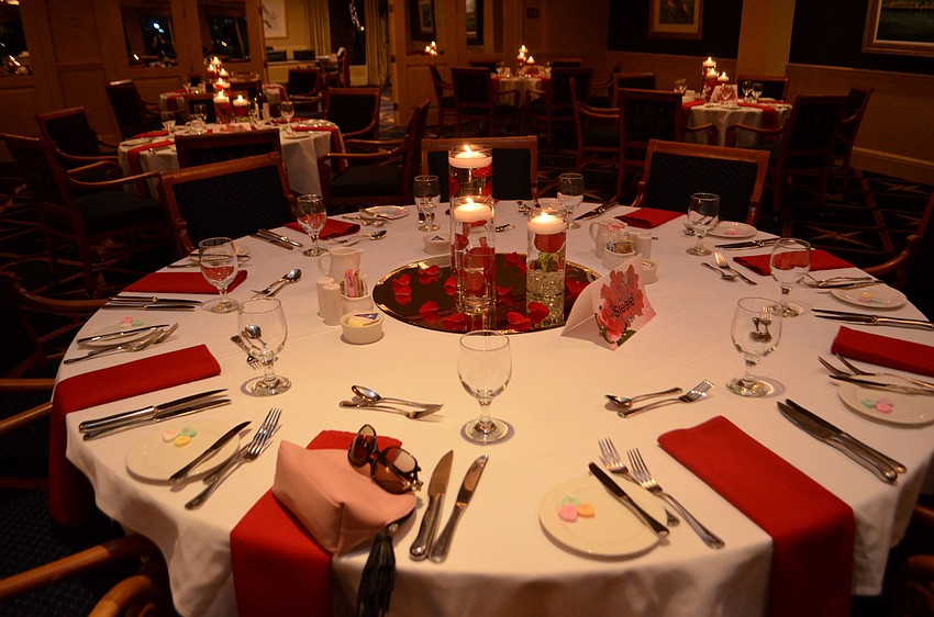 Floating candles and flowers adorned each table. The evening was an early Valentine’s Day celebration featuring a performance by Eddie Tobin.