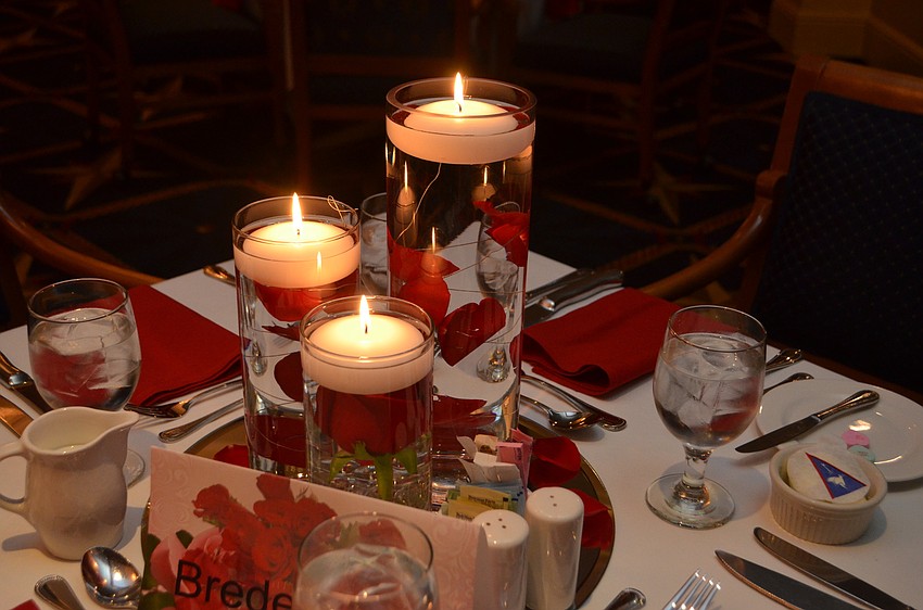 Floating candles and flowers adorned each table. The evening was an early Valentine’s Day celebration featuring a performance by Eddie Tobin.
