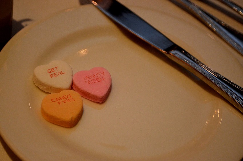 Candy hearts were set on each guests table. The evening was an early Valentine’s Day celebration featuring a performance by Eddie Tobin.
