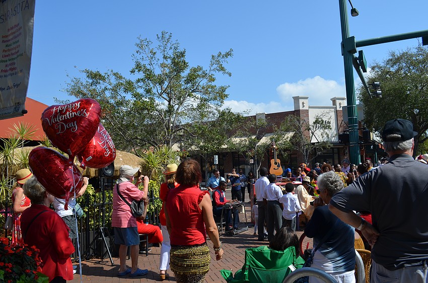 A growing audience takes in the performance at Main Street and Lemon Avenue.