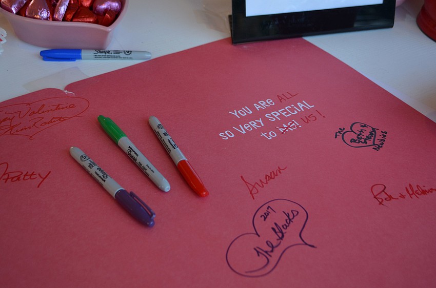 Attendees signed a card for Longboat Key.