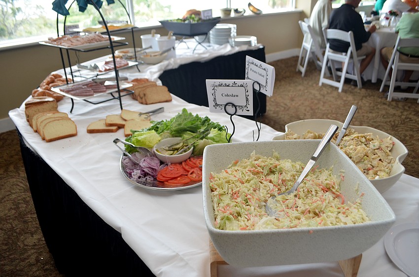 Golfers enjoyed a buffet lunch that included hot dogs, hamburgers, coleslaw, sandwiches and salad.