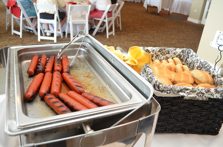 Golfers enjoyed a buffet lunch that included hot dogs, hamburgers, coleslaw, sandwiches and salad.