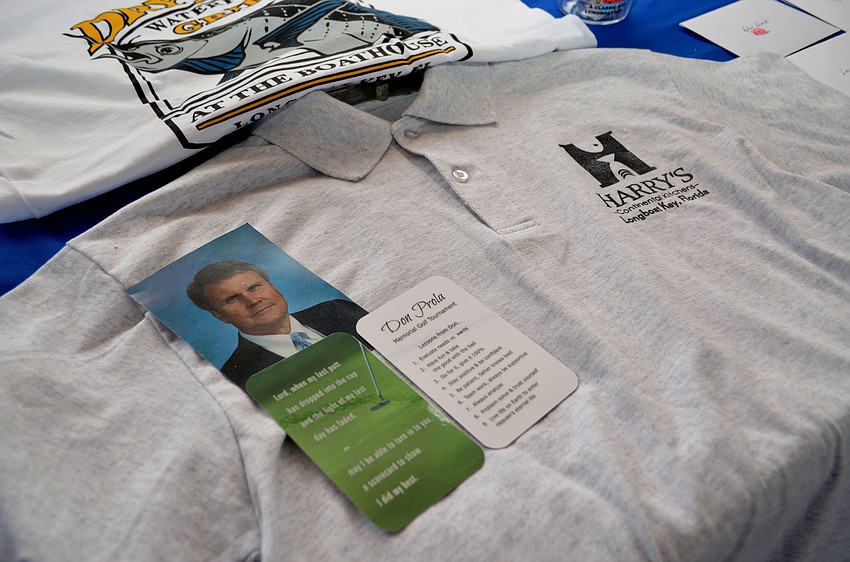 Attendees got small cards with Don Prola sayings. There were also raffle prizes available including apparel from Longboat Key restaurants like Harry’s Continental Kitchens and Dry Dock Waterfront Grill.