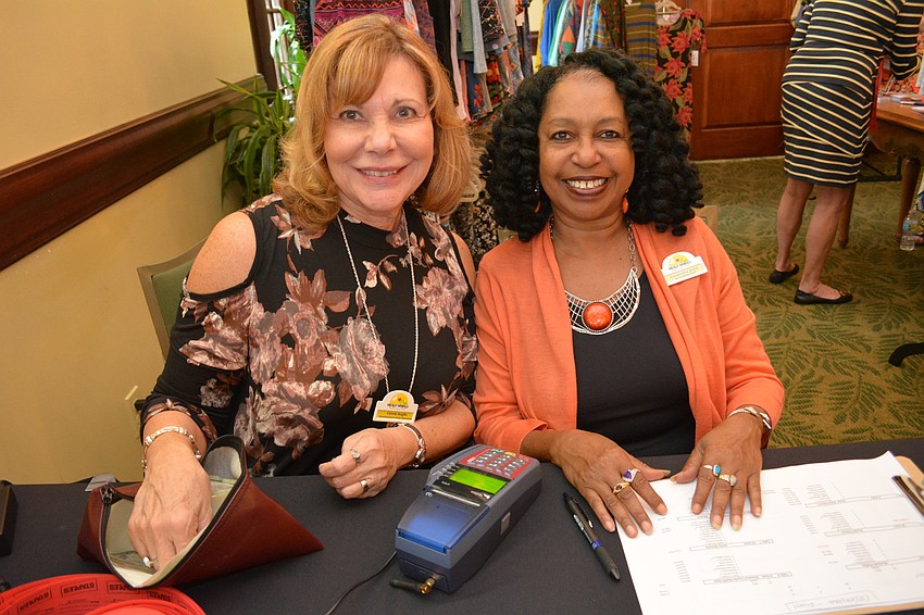 Meals on Wheels PLUS employees Connie Anglin and Cassandra Brice register guests.