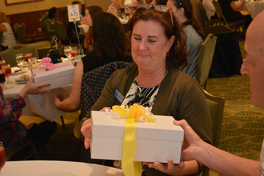 Terry Wells, of Parrish, almost wins a baby shower gift at her table.