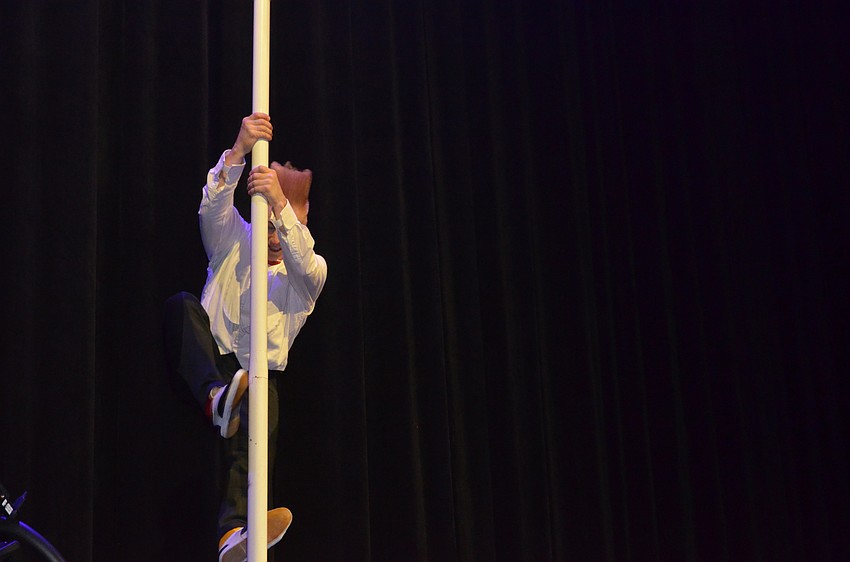 Bello Nock climbs to the top of a pole to “open the curtains” at the Big Top Gala on Feb. 25 at Feld Entertainment Studios.