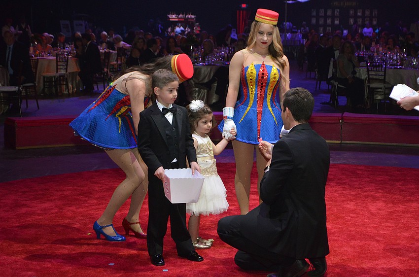 Logan Lesselroth gets to pick the winning raffle number at the Big Top Gala on Feb. 25 at Feld Entertainment Studios.