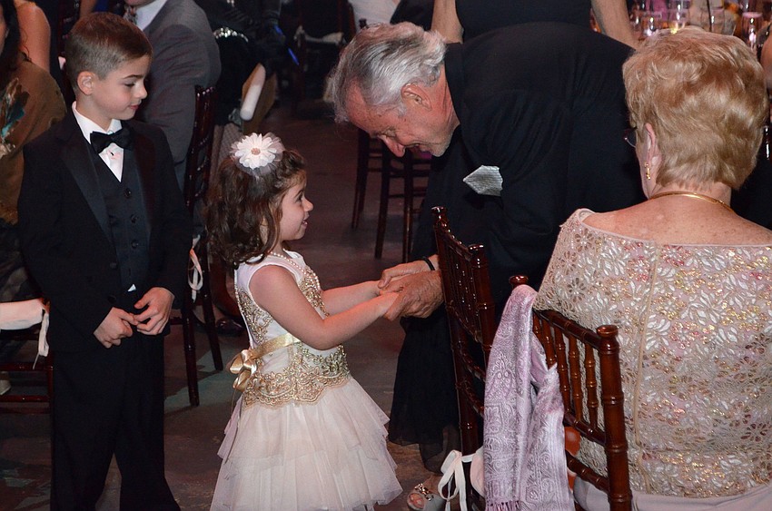 Gianna Lesselroth thanks Dr. Charles Loewe for his generous donation at the Big Top Gala on Feb. 25 at Feld Entertainment Studios.