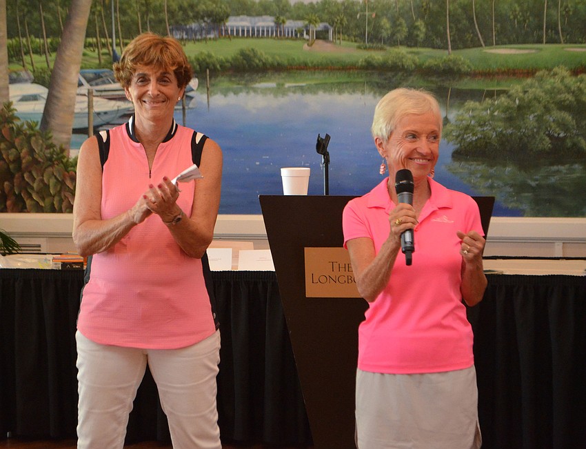 Event chairwomen Jayne Weiss and Gwen Watson smile as they talk to the golf associations’ members on Feb. 28.