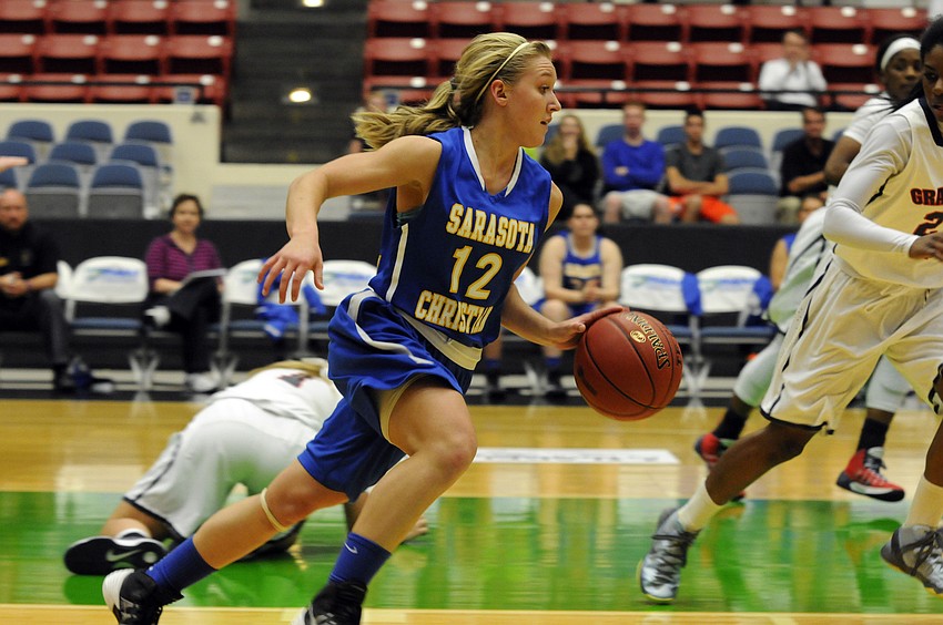 Sarasota Christianâ€™s McKenzie Lantz pushes the ball down the court in the second quarter.