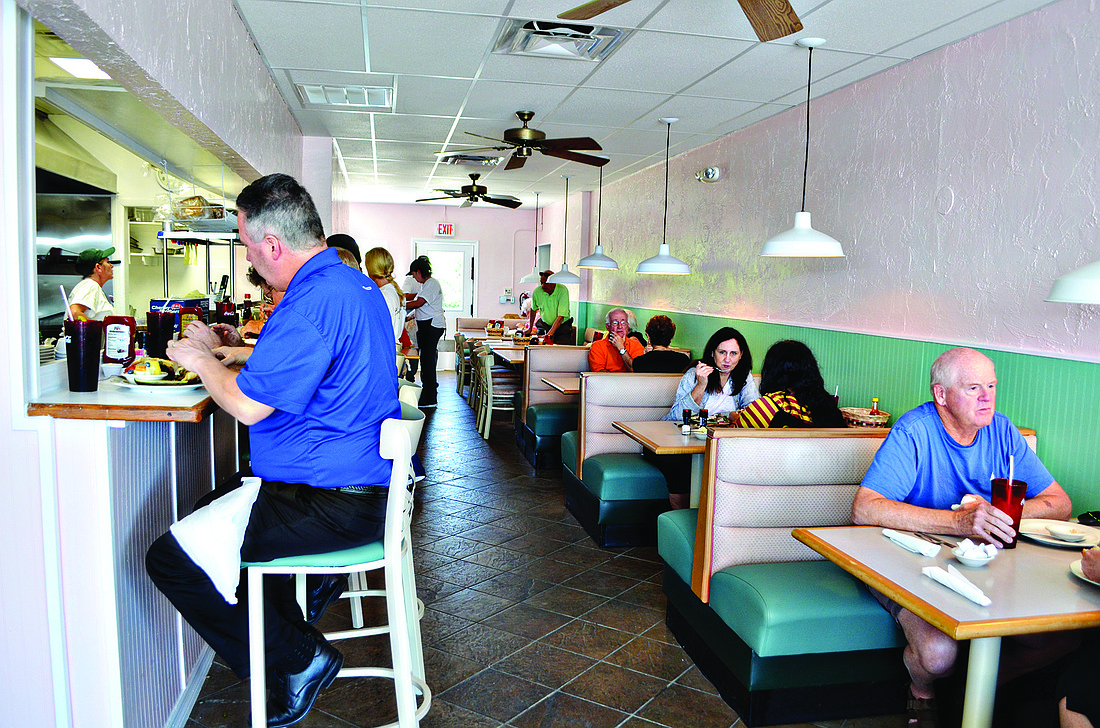 Most tables were occupied at lunchtime during the Longbeach CafÃƒÂ©Ã¢â‚¬â„¢s first day of business. (Photo by Robin Hartill)