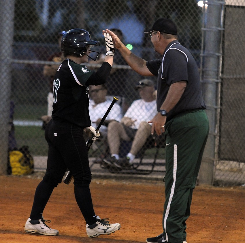 Lakewood Ranch coach Tony Cummins congratulates freshman Kaylee Misiti following her RBI double.
