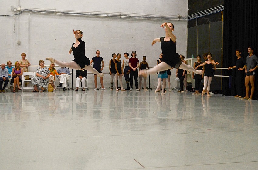 The dancers take turns doing a series of leaps across Studio 1