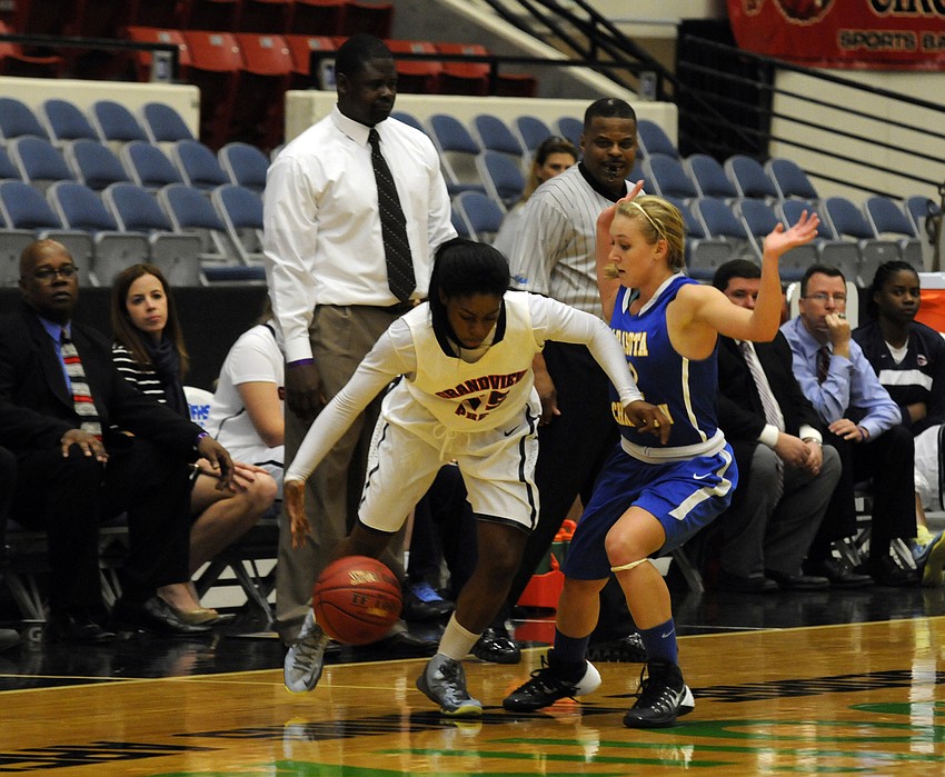 Sarasota Christianâ€™s McKenzie Lantz applies stiff defensive pressure on Grandview Prepâ€™s Neydja Petithomme.