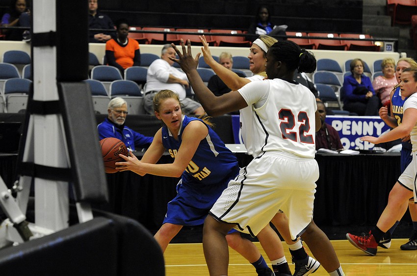 Sarasota Christianâ€™s Heidi Miller looks for an open teammate after hauling in a rebound in the second quarter.