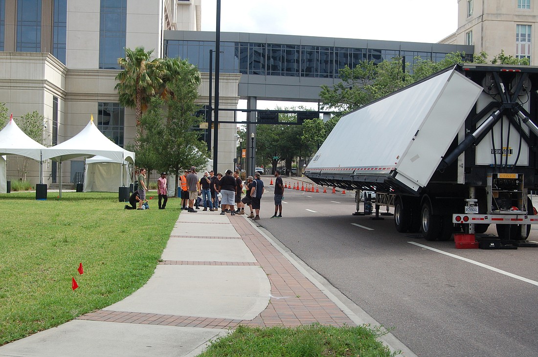 Stagehands prepared Tuesday morning to set up the Jacksonville Jazz Festival stage at the Duval County Courthouse. The annual event begins Friday and ends Sunday.