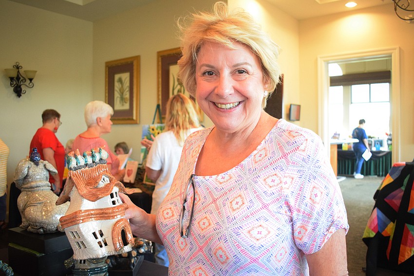 Waterlefe's Jill Pokorn shows off the house she bought from artist Sue Kerr. 