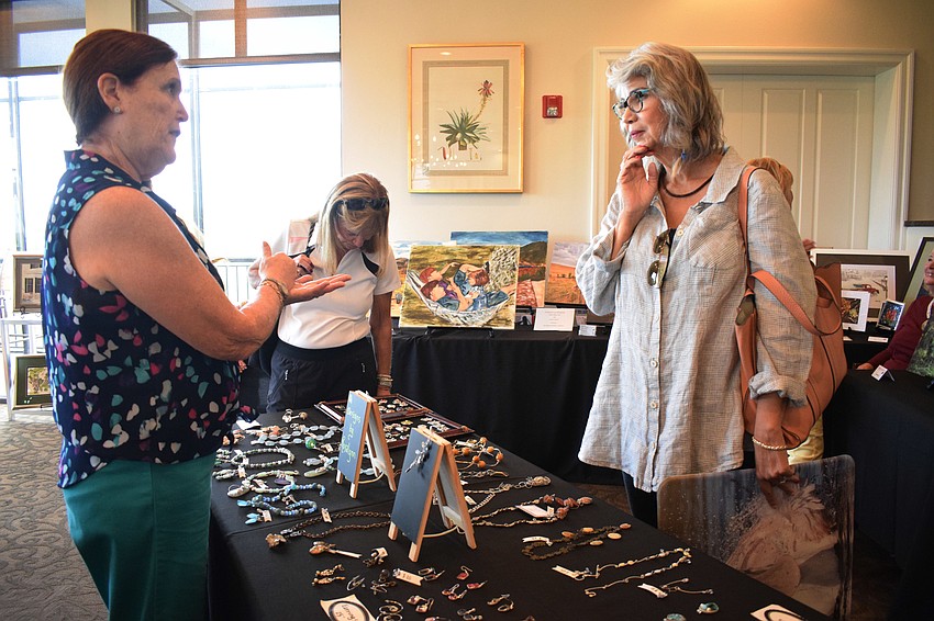 Waterlefe's Rosalynn Kiefer talks about the jewelry she makes to Waterlefe's Nancy Cole and Pat Hershberger.