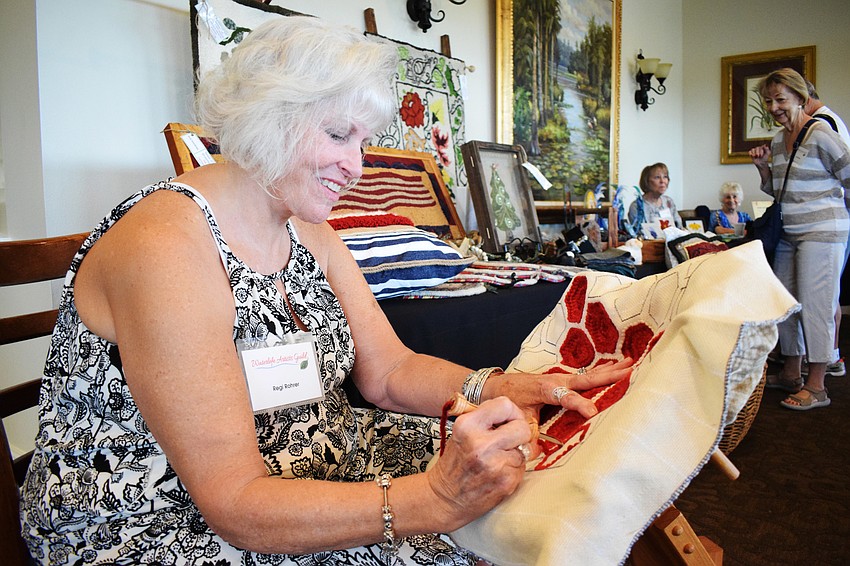 Waterlefe's Regi Rohrer works on a piece using rug hooking.
