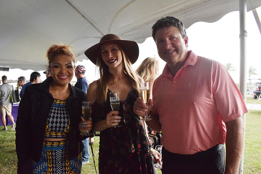 Parrish's Isabel Macgloan, Terra Ceia's Karissa Campbell and Bradenton's Hugh Miller enjoy tasting wines together.