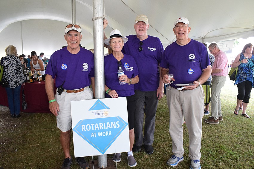 Vince Cera, Cecelia Abruscato, Steve Briggs and Jim Frederick volunteer for the Rotary Club of Lakewood Ranch during the Suncoast Food and Wine Fest.