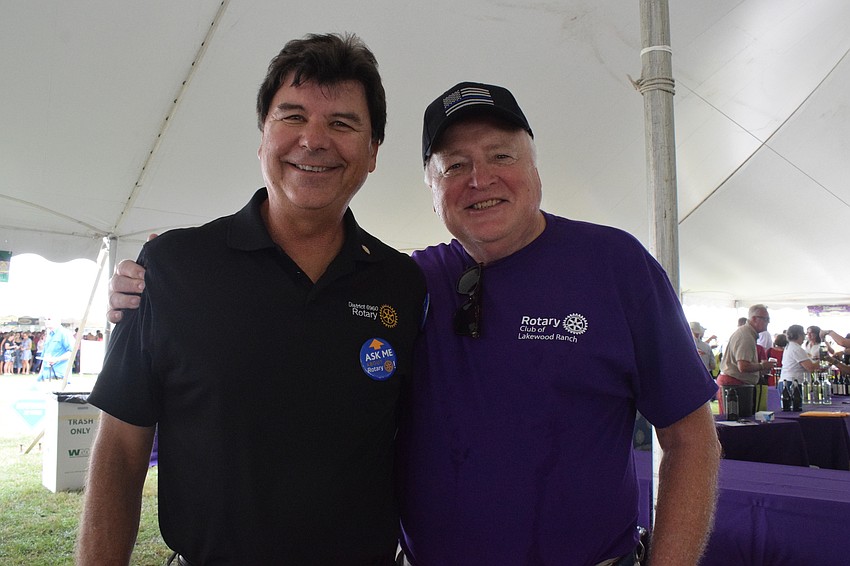 Steve Bordes and Eckhard Kuesters, who are members of the Rotary Club of Lakewood Ranch, are excited to see people return to the Suncoast Food and Wine Fest.
