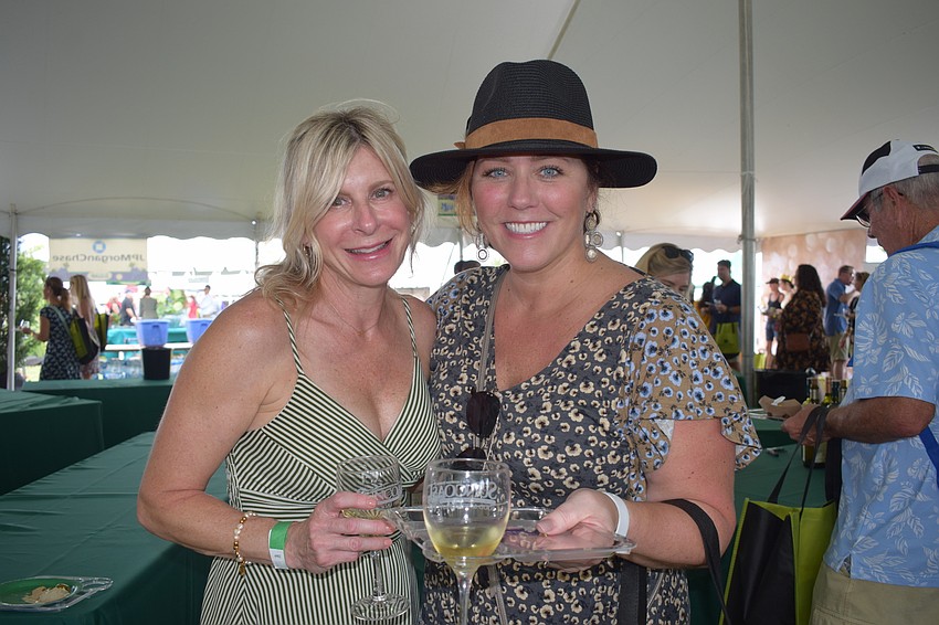 Summerfield's Jennifer Colombo and River Club's Bethany Lynch go around trying different wines.