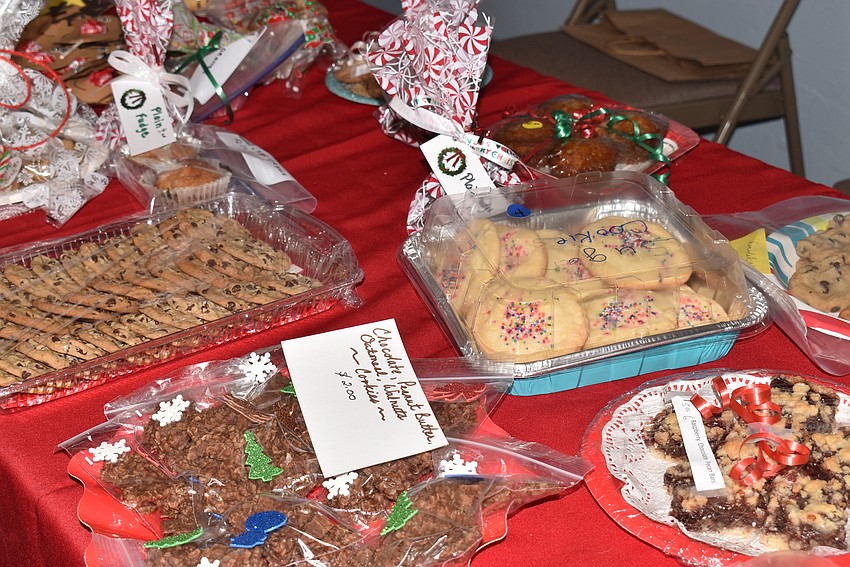 A long table was well-stocked with baked treats, which buyers snacked on soon after buying.