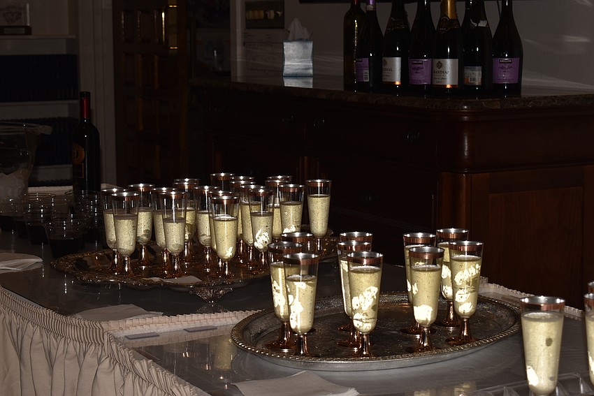 Attendees grabbed a glass of champagne as they walked in.